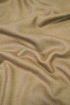 Gold pashmina shawl close-up of soft cashmere-blend fabric weave