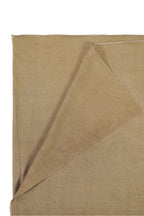 Gold pashmina shawl folded corner on white background