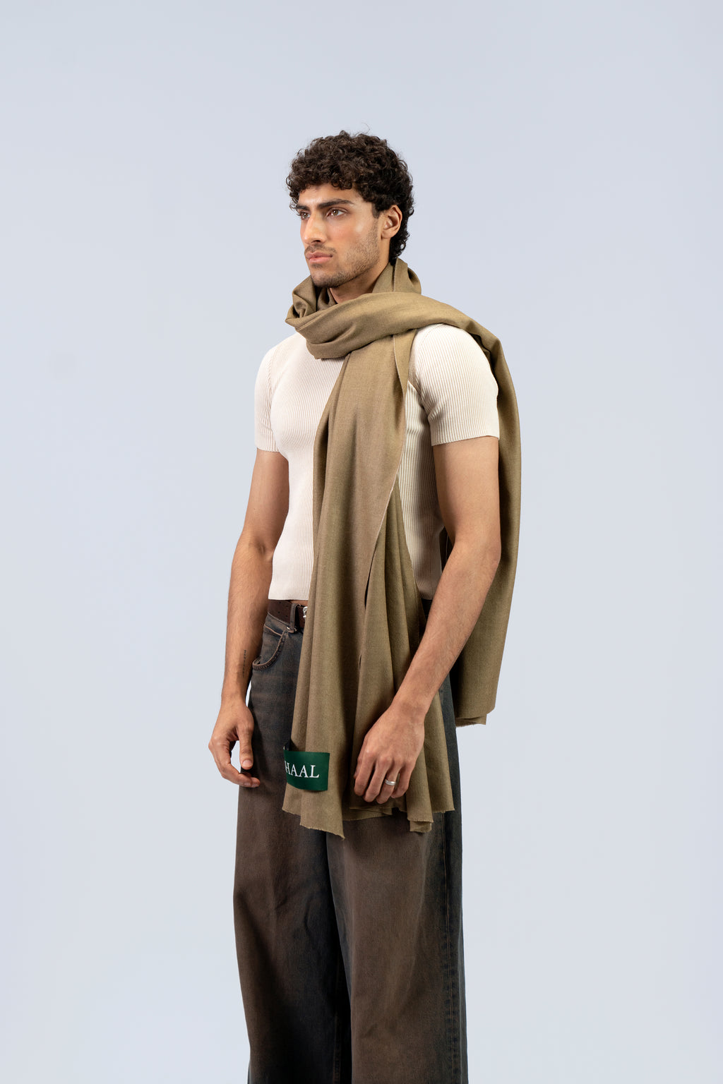 Gold pashmina shawl on male model, three-quarter side view with SHAAL label