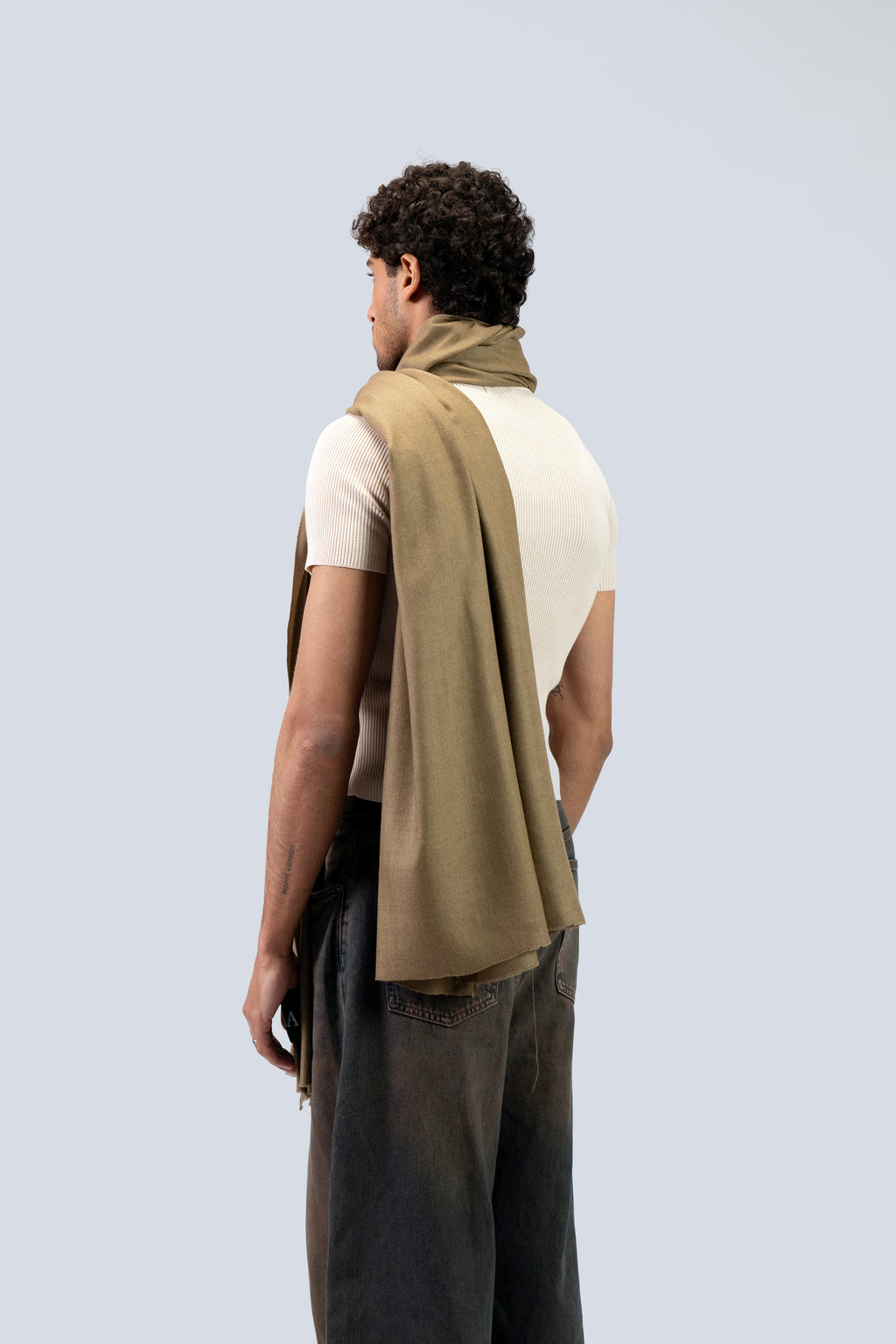 Gold pashmina shawl from behind on male model, three-quarter back view