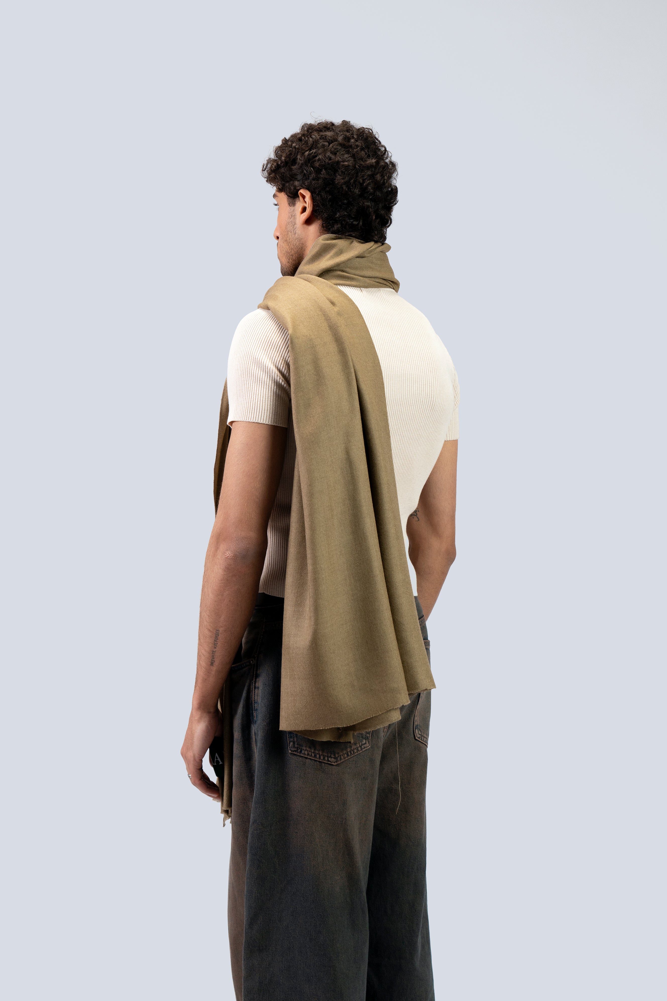 Gold pashmina shawl from behind on male model, three-quarter back view