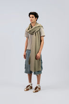 Silver pashmina shawl on male model, three-quarter side view