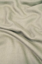 Silver pashmina shawl close-up of soft cashmere-blend fabric weave