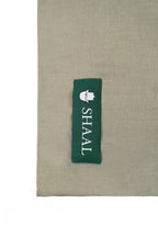 Silver pashmina shawl detail of green SHAAL woven label