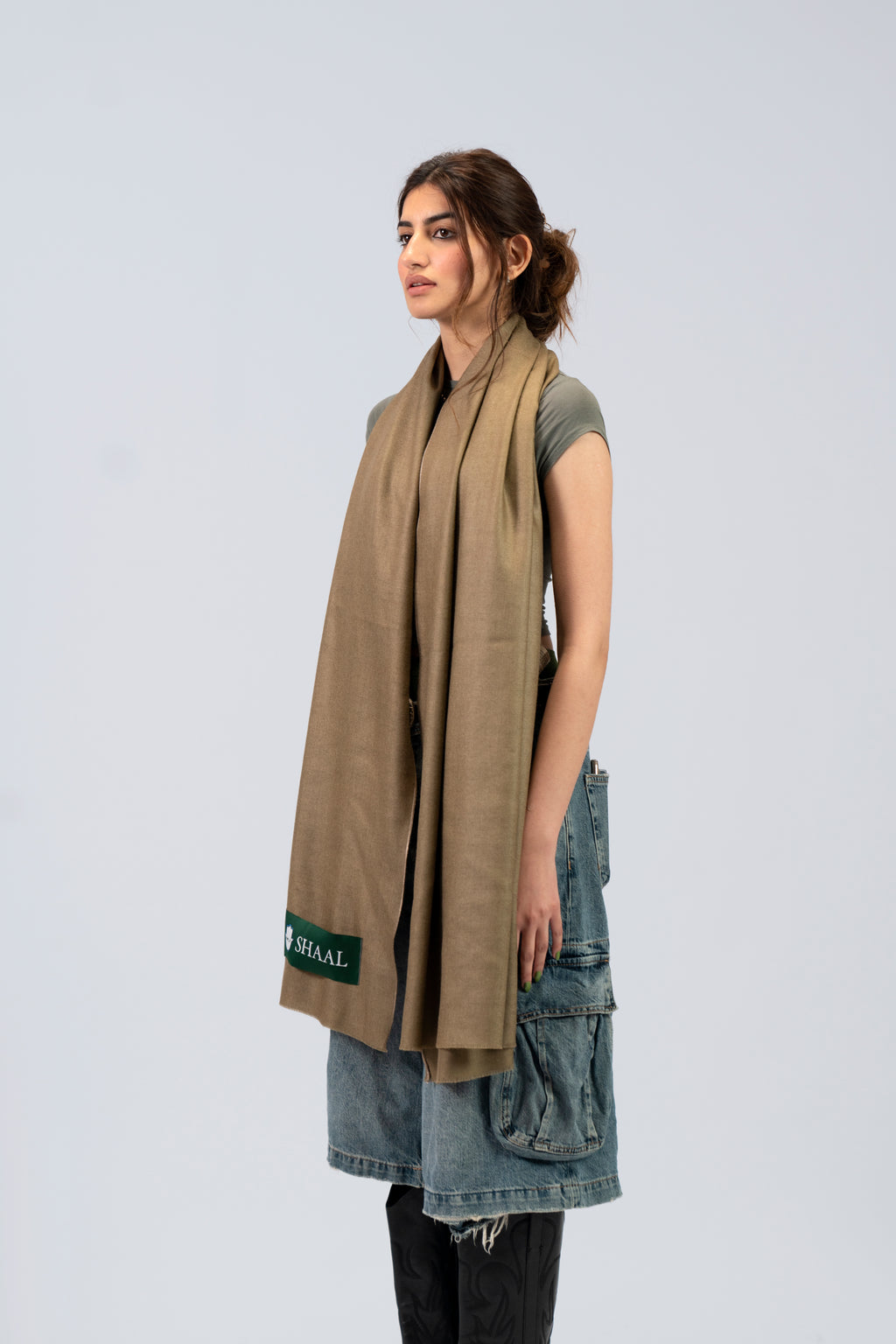 Brown pashmina shawl on female model, three-quarter side view