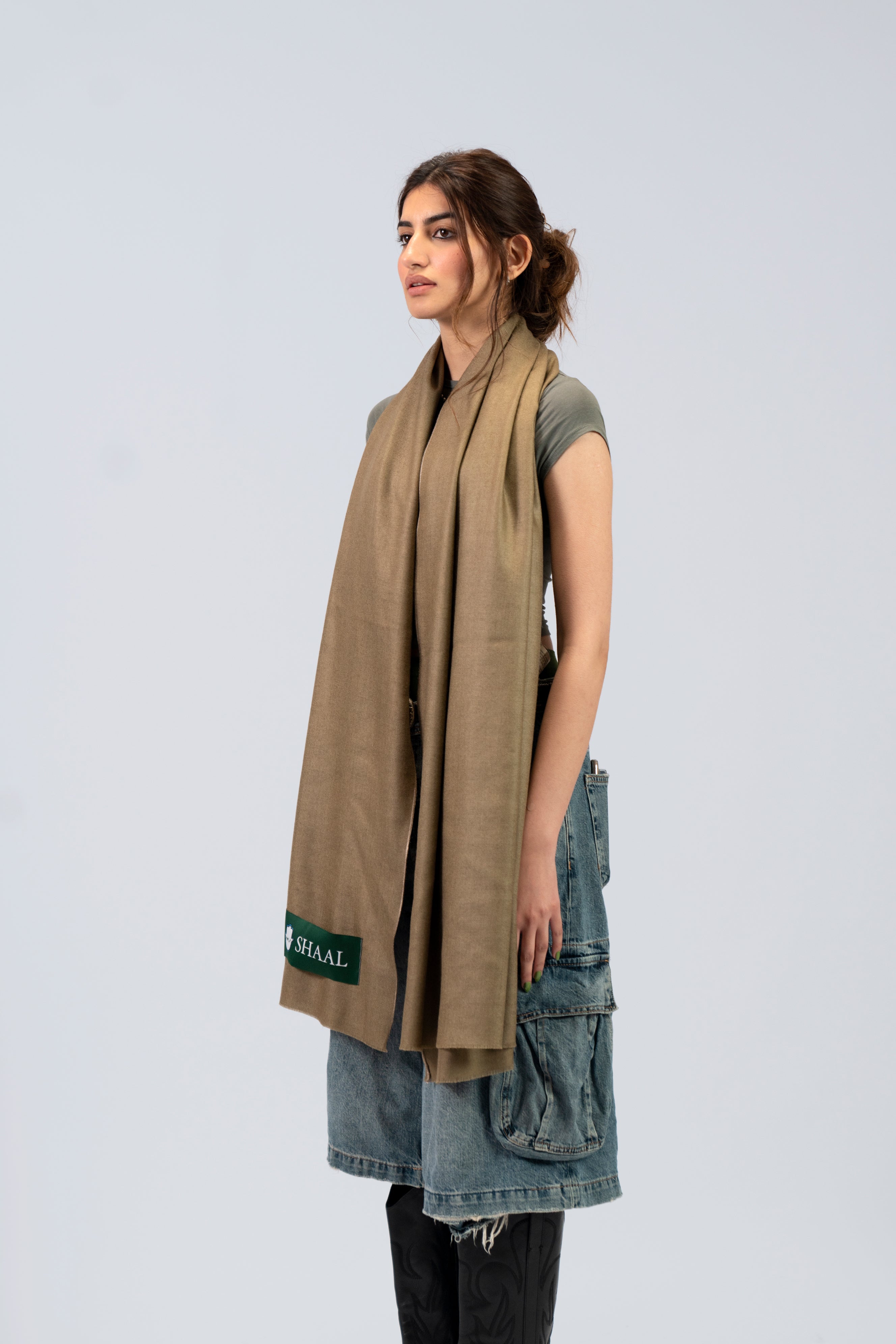 Brown pashmina shawl on female model, three-quarter side view