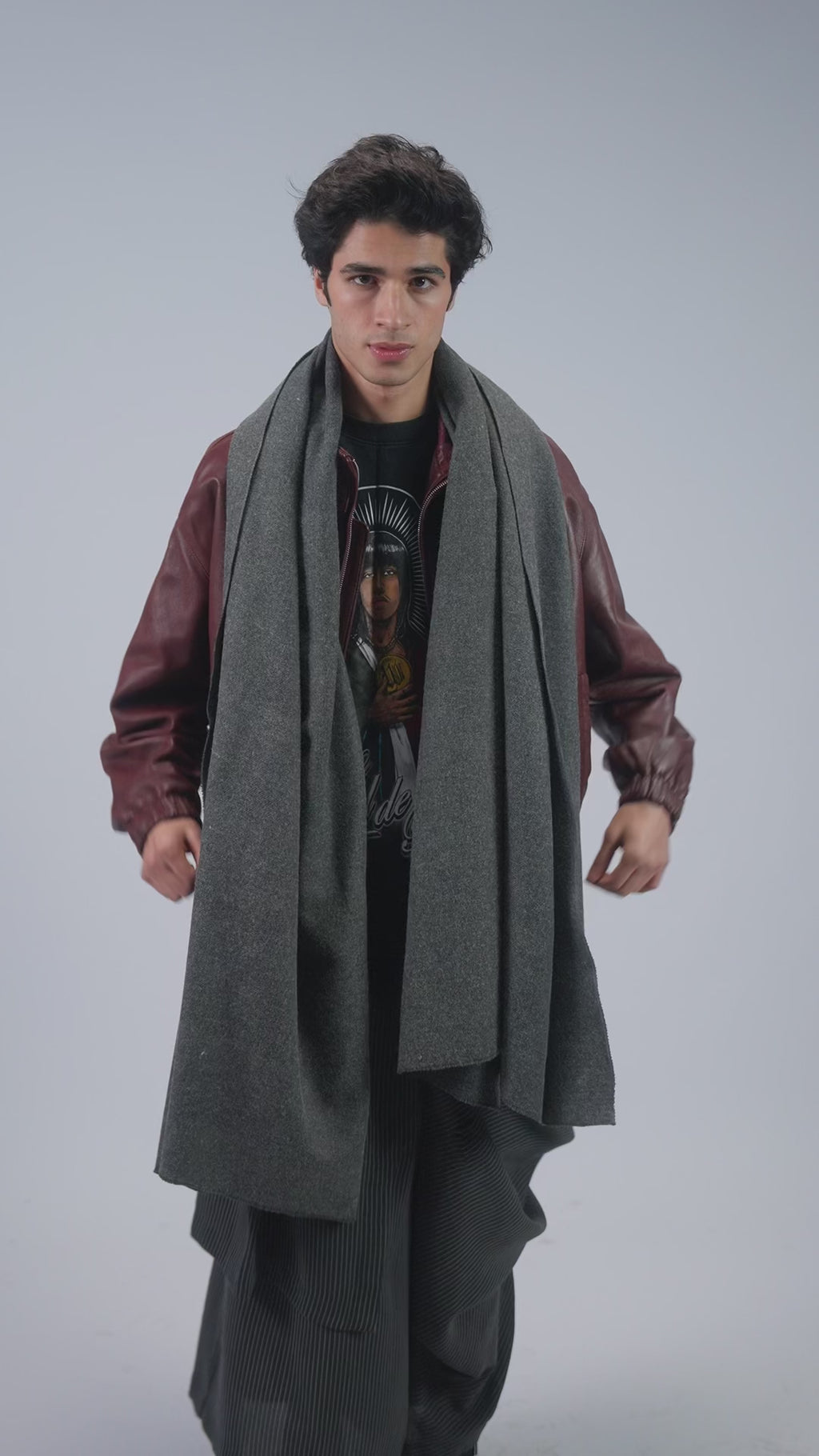Gray handwoven wool shawl worn by model, full-length video
